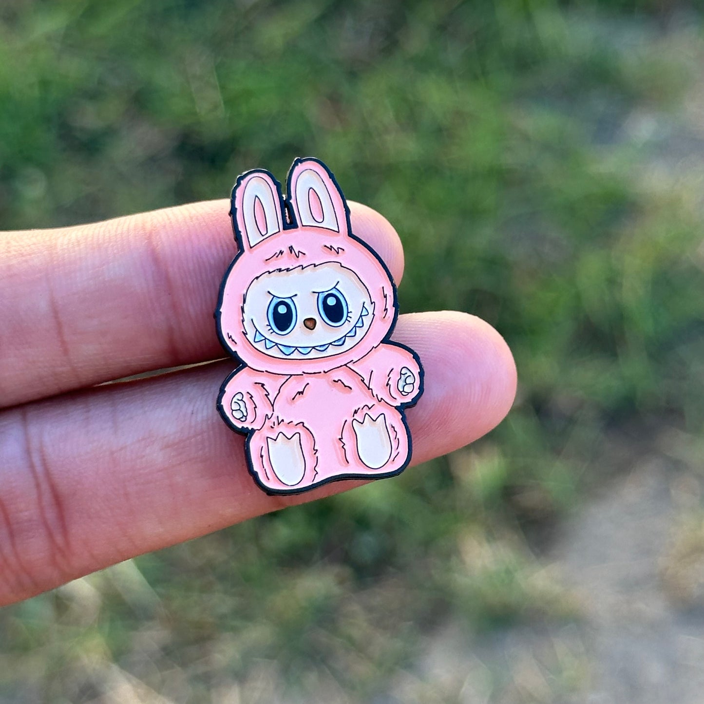 Sitting pink Monster pin