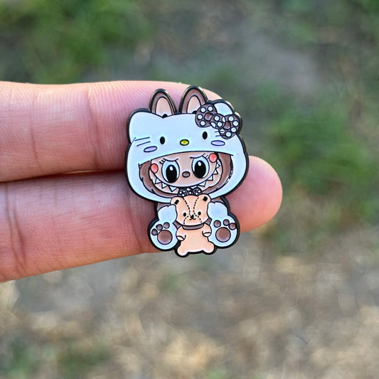 Monster with teddy bear pin