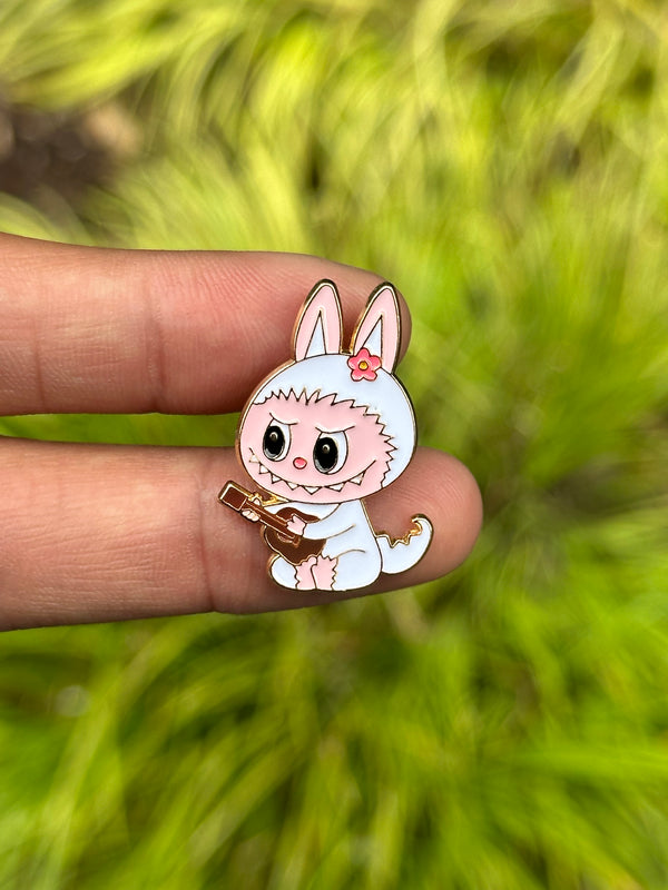 Monster with guitar pin